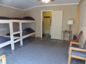 North bunkhouse with 2 sets of bunk beds and a full bath.