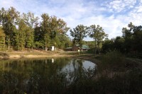 A panoramic view of the Lodge and pond.