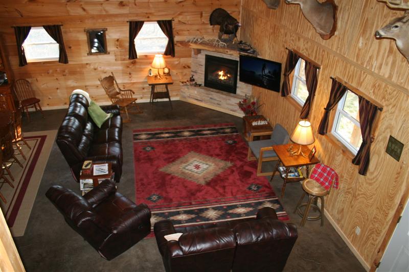 A view of the living area from the loft .
